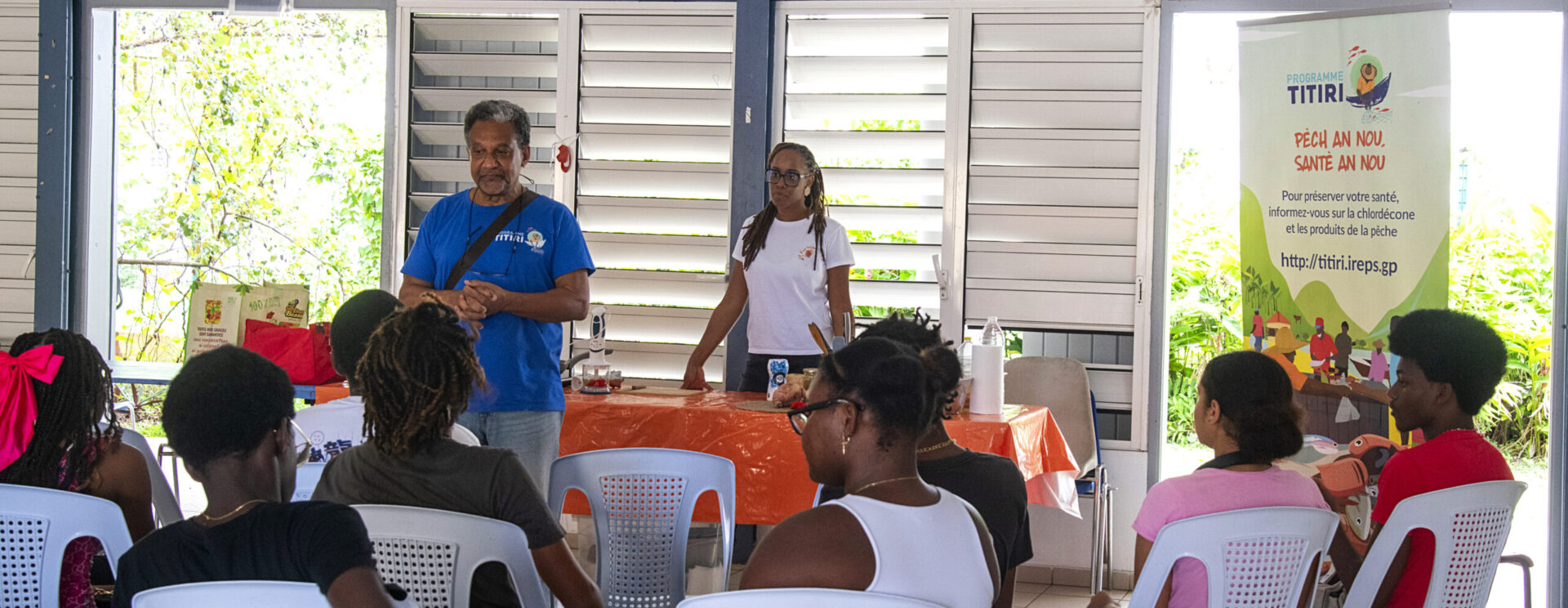 Animation de sensibilisation du programme Titiri porté par Promotion Santé devant un groupe de participants dans une salle en Guadeloupe.